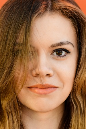 Closeup sensual portrait of beautiful girl outdoors.の写真素材