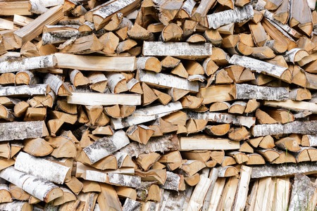Stack of chopped firewood prepared for winter.