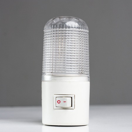 A new generic LED night light that turns on automatically in darkness on a white background.