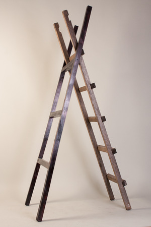 Two wooden ladders on a gray background.の写真素材