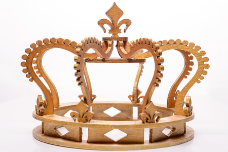 close-up of golden royal crown on white background.の写真素材