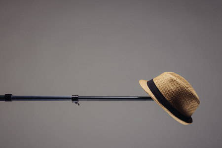 stylish men's straw hat on a photographic stand. Horizontal frameの写真素材