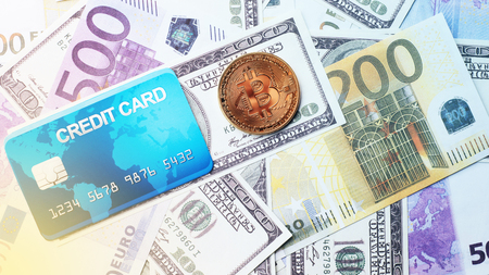 Concept bank card bitcoin on a money background - Imageの写真素材