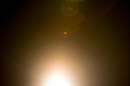 Flash of a distant abstract star. Abstract sun flare. The lens flare is subject to digital...