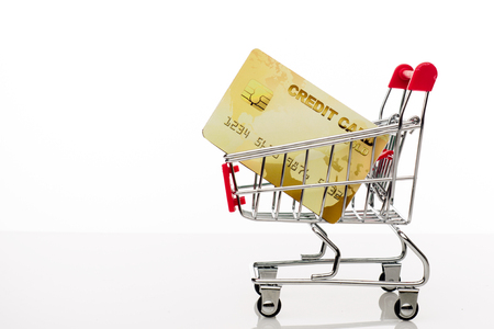 Shopping cart with credit card and copy space on white background - imageの写真素材