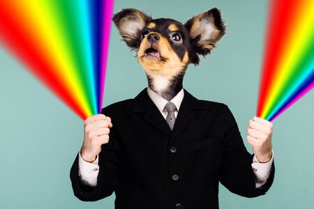 Psychedelic collage combining a man in a suit and a dog's head. The character holds a rainbow in his hands and looks up. The mouth is open in surprise. - imageの写真素材