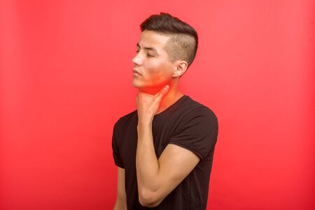 Sick asian man suffering from sore throat. Causes include flu, common cold, bacterial infections,...