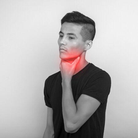 Sick asian man suffering from sore throat. Causes include flu, common cold, bacterial infections,...