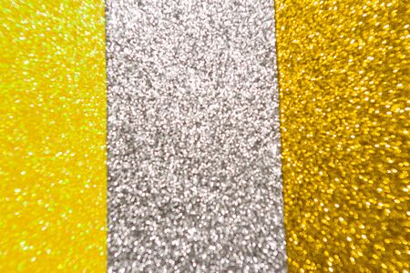 Abstract Christmas background wallpaper diamond and effect lighting for design. Golden yellow and silver bokeh glitter lightsの写真素材