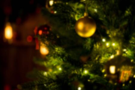 Christmas home room with tree and festive bokeh lighting, blurred holiday background. Templateの写真素材