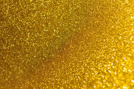Abstract Christmas background wallpaper diamond and effect lighting for design. yellow bokeh glitter lightsの写真素材