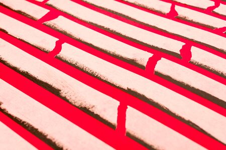 close up of an adhesive tape on red background.