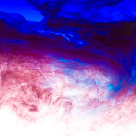 Cloud of ink in water isolated on white. Color of the year 2020. - imageの写真素材