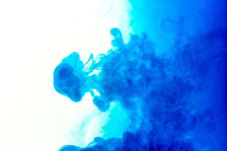 Cloud of ink in water isolated on white. Color of the year 2020. - imageの写真素材