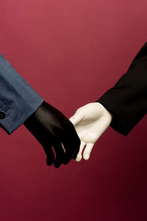 Focus on handshake of partners at meeting. shaking hands mannequin