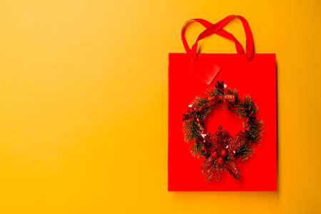 top view yellow shopping bag on the table with the holiday seasonの写真素材