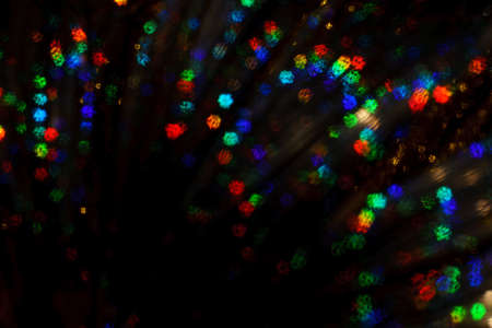 Christmas background. Festive abstract background with bokeh defocused lights and stars.