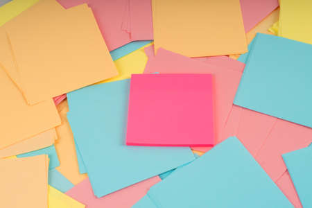 Pile of clear colorful paper notes. Closeup.