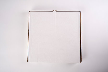 close up of a white pizza box template on white background.の写真素材