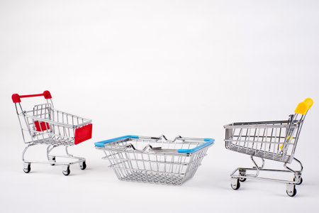 Empty grocery shopping cart. Isolated over white background.の写真素材