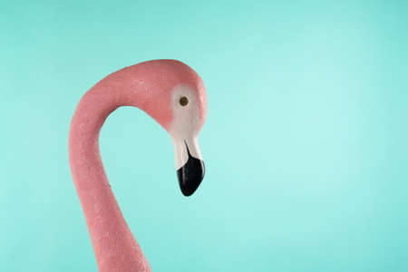 Decorative figure of pink flamingo on blue background.の写真素材