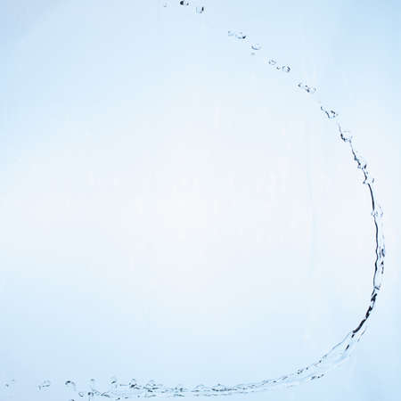 beautiful splashes a clean water on blue gradient background.の写真素材