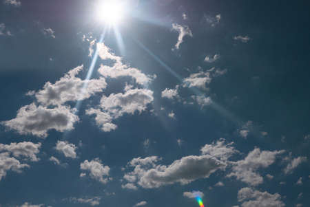 sun shining above beautiful stormy clouds, sky is clearing after rainの写真素材