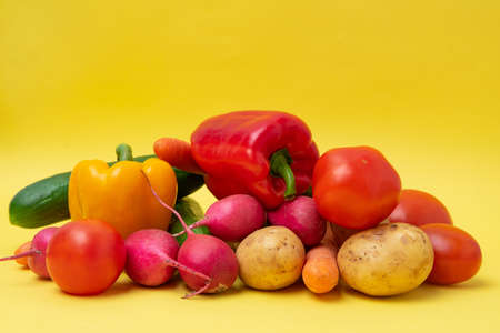 Organic vegetables on a yellow background