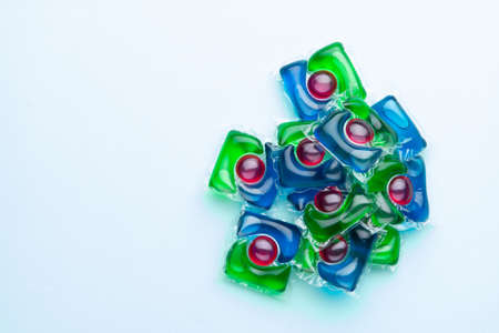small pile of water soluble capsules for washing clothes or dishwasher