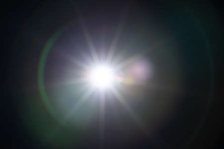 Sun flare on the black backgroundの写真素材