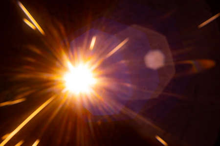 Sun flare on the black backgroundの写真素材