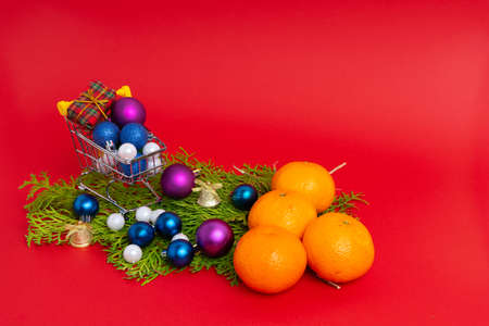 Tangerines and christmas tree toys in a New Year's composition. New year's still lifeの写真素材