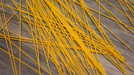 top view Various types of Italian pasta on wooden background