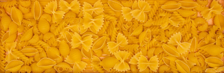 top view Various types of Italian pasta on wooden backgroundの写真素材