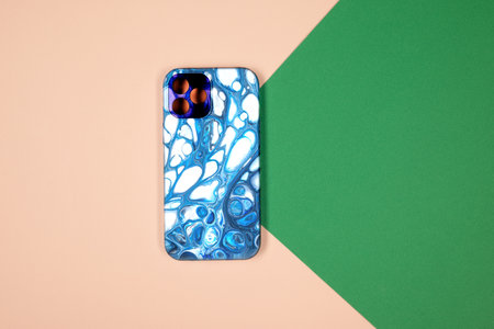 blue phone case back view. Template of iphone 12 plus case. Green and beige backgroundの写真素材