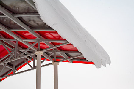 Internal structural elements of an iron roof. snow on the edgeの写真素材