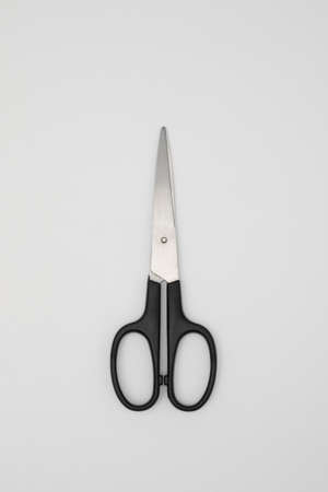 Black handled scissors isolated on white backgroundの写真素材