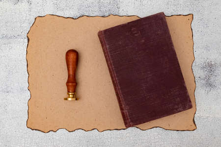 Blank parchment stamp vintage book on old wooden tableの写真素材