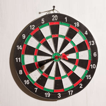 dart on target on white backgroundの写真素材