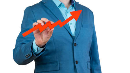 businessman holding a red arrow chart pointing upの写真素材