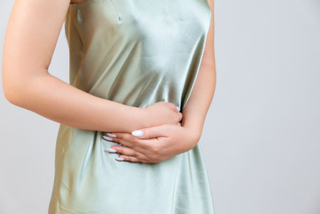 Menstrual pain, woman with stomachache suffering from pms , endometriosis, cystitis and other diseases of the urinary systemの写真素材