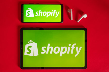 Tokyo, Japan - June 05, 2022: Shopify web page displayed on a modern laptop, smartphone and notebook...