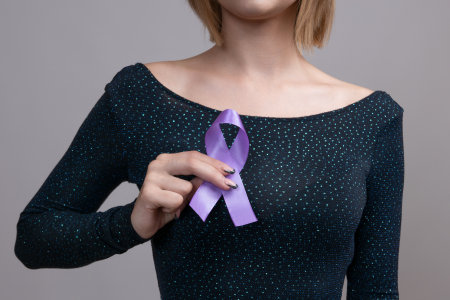 Woman holding a purple ribbon in her hands ADD,ADHD,Alzheimer Disease ,Arnold Chiari Malformation,Childhood Hemiplegia stroke, Epilepsy, Chronic Acute Pain,Crohnsの写真素材