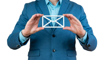 Businessman hand holding e-mail icon lette, postal envelope, concept of spam email, internet and networking, Contact us newsletter email and protect your personal.の写真素材