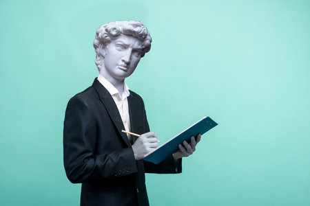 Abstract modern collage. The man with the plaster head of David carrying a clipboardの写真素材