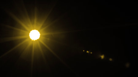 Abstract Natural Sun flare on the blackの写真素材