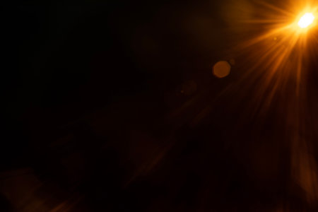Abstract Natural Sun flare on the blackの写真素材