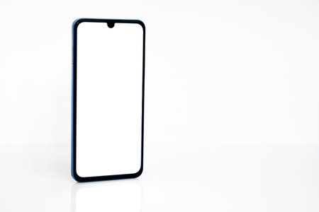 Black mobile smartphone mockup with blank screen isolated on white background , Can use mock-up for your application or website design project.の写真素材