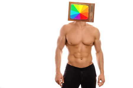 Modern minimal retro collage art. Young sexy muscular macho man posing with naked torso with a television as a headの写真素材