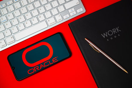 Kyoto city, Japan - May 05, 2023: The logo of Oracle visible on a smartphone screen traded computer software companyのeditorial素材